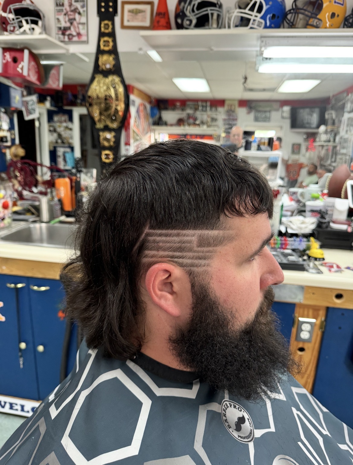 Detailed line design shaved into a customer's fade